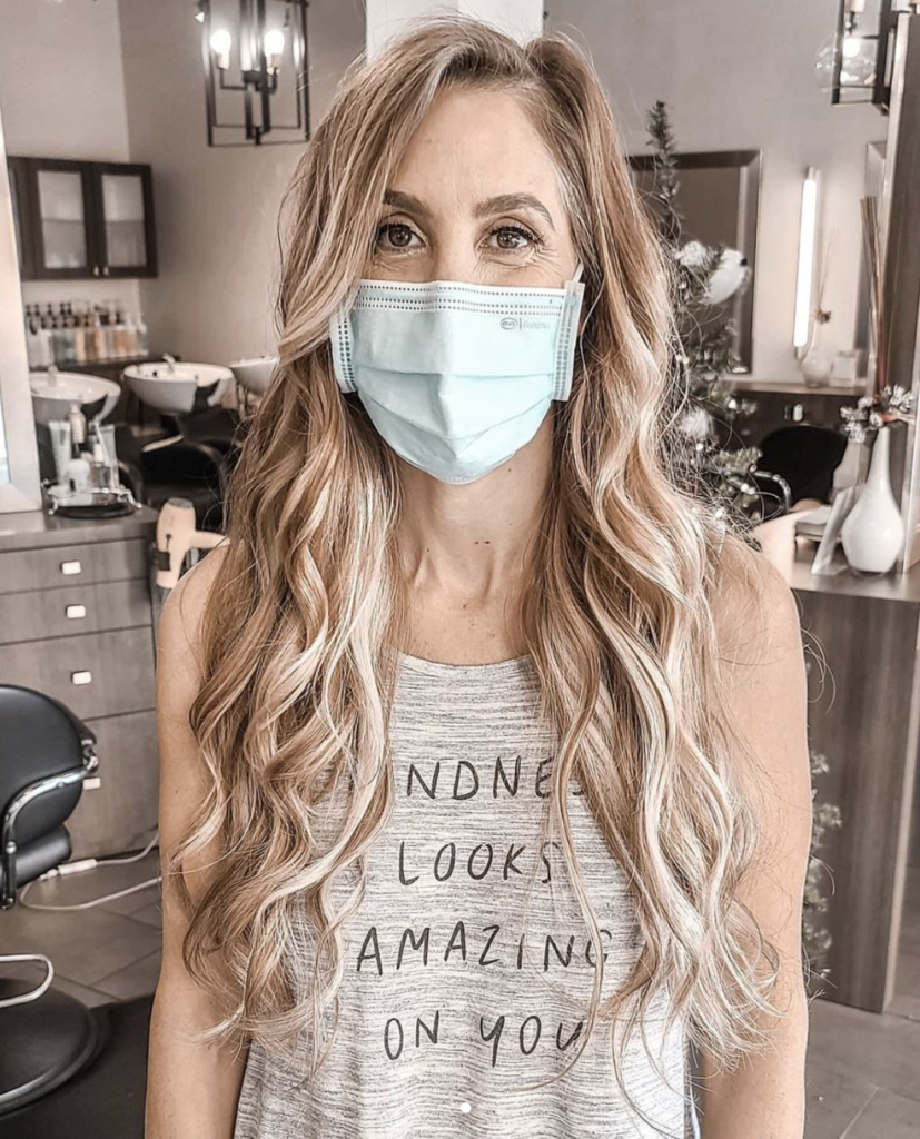 Hand-tied hair extension application changes salon