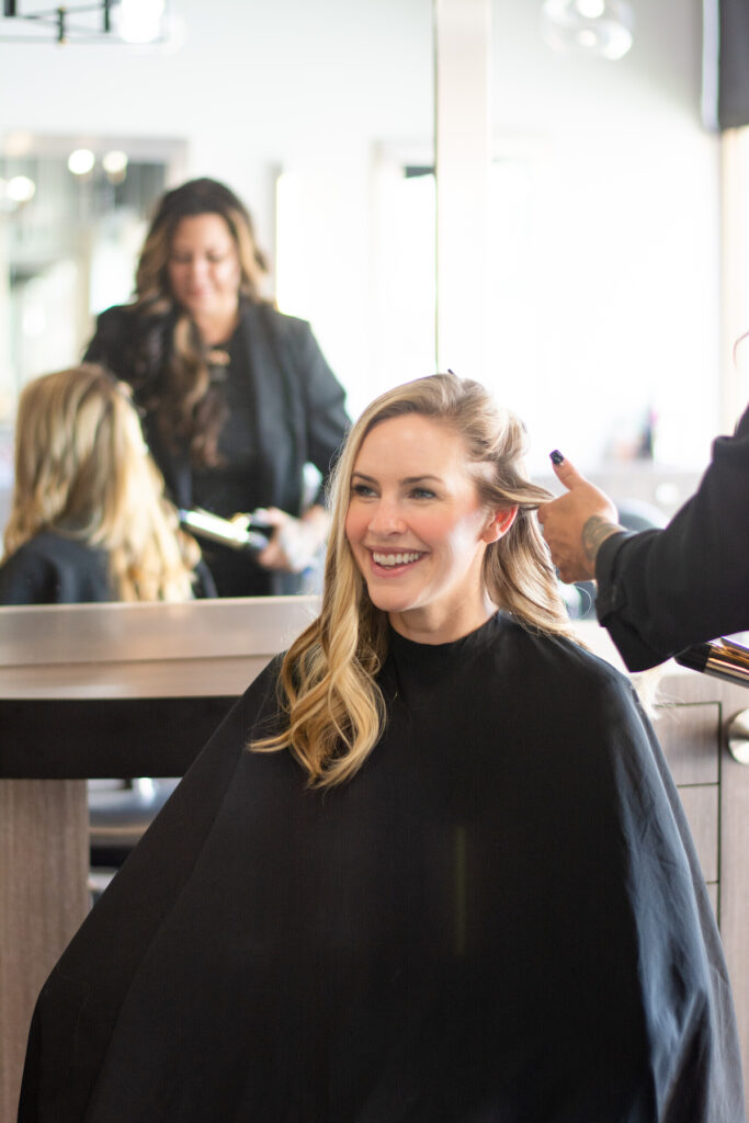 A blonde woman enjoying hair services at changes salon and day spa in downtown walnut creek.