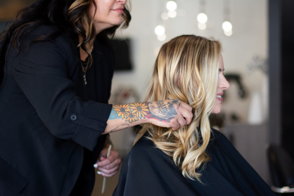 changes hair stylist showing off color